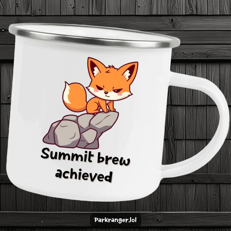 Funny camping mug with a small, playful fox character determinedly scaling a rock, ready for the outdoors.