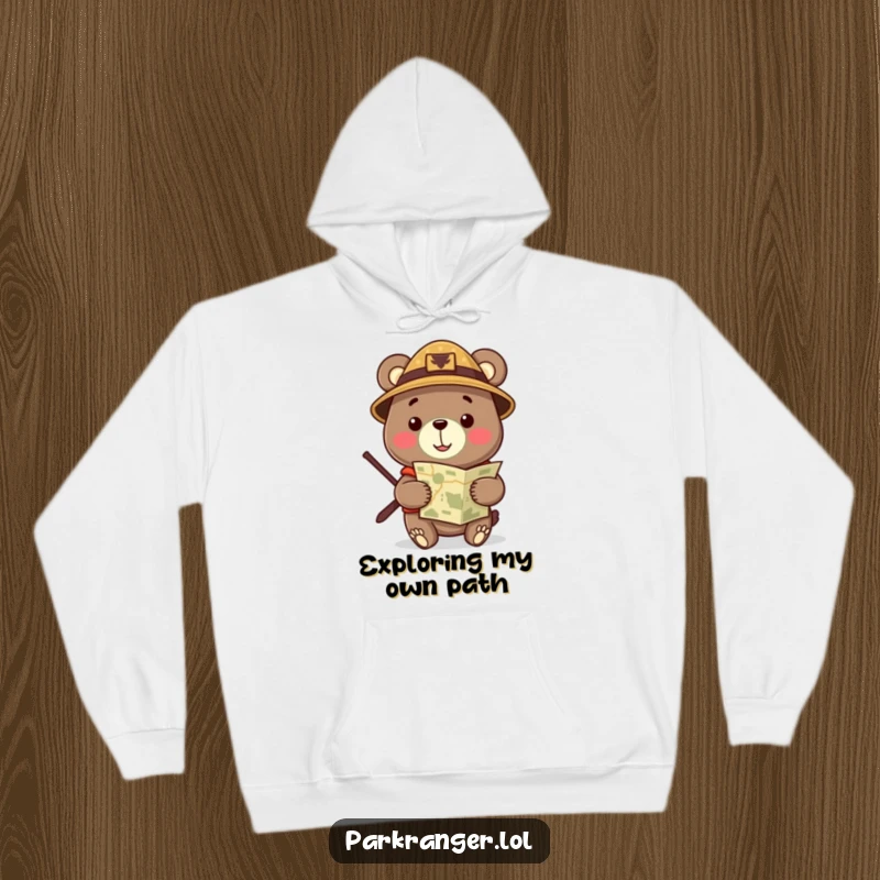 Funny Hoodie showcasing a cheerful bear in a ranger hat, confidently holding a map, ready for any wilderness trek.