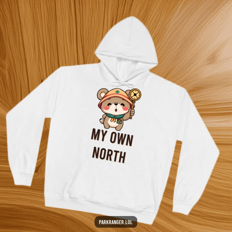 Funny hoodie depicting a scout bear character with a compass, radiating a sense of direction and humor for outdoor enthusiasts and gift-givers.