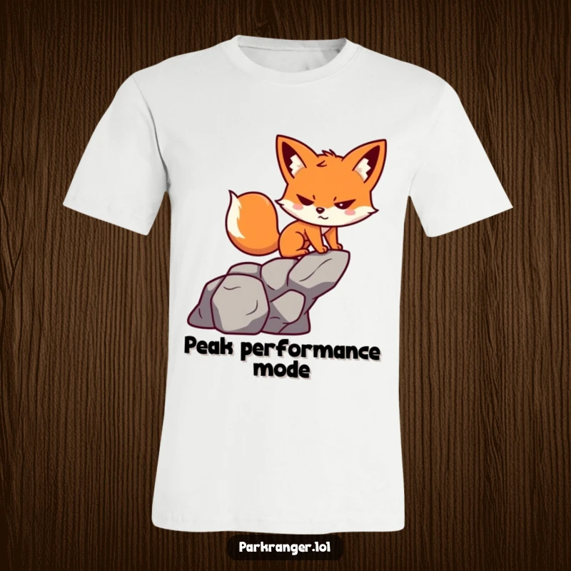 Funny T-Shirt: A small, playful fox character with a determined grin scales a rock, embodying adventurous spirit.